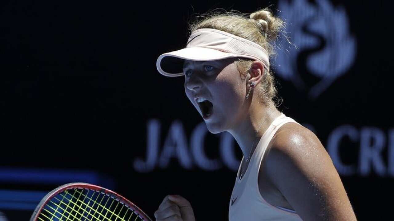 Ukraine's Marta Kostyuk celebrates a point win over Australia's Olivia Rogowska during their second round match at the Australian Open tennis championships in Melbourne, Australia, Wednesday, Jan. 17, 2018. (AP Photo/Dita Alangkara)