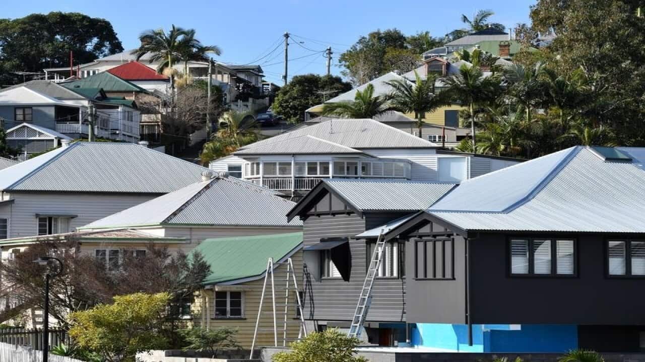 Traditional Queenslander houses are seen in the Brisbane