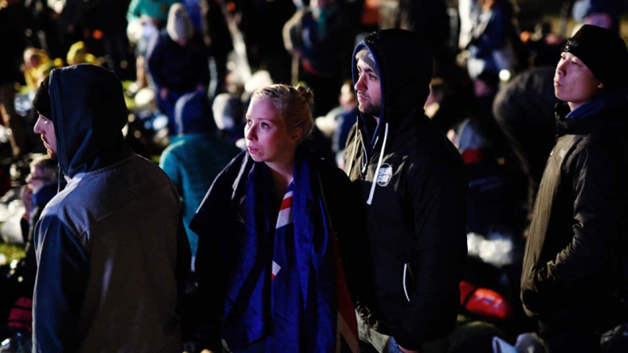 Visitors attend the Dawn Service ceremony at Anzac Cove
