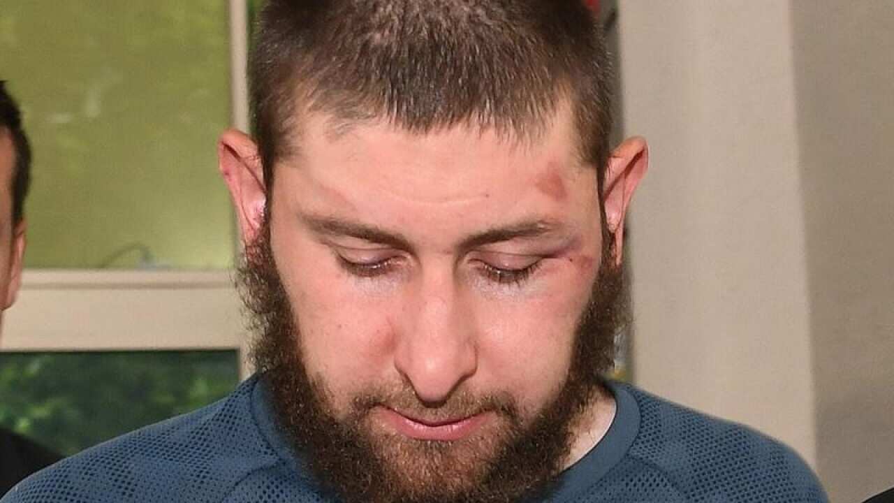 Terrorism suspect Ertunc Eriklioglu has faced court in Melbourne with two other men.