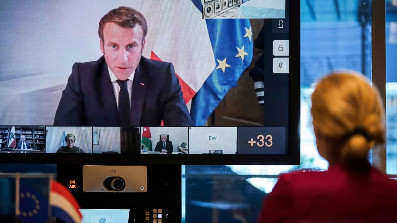 Dutch Minister for Development and Cooperation Sigrid Kaag speaks with French President Emmanuel Macron and other world leaders during a donor teleconference.