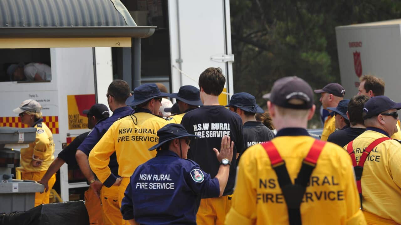 Fireman at the One Tree Hill staging area as fires continue to burn through the Adelaide Hills, Sunday, Jan. 4, 2015. (AAP Image/David Mariuz) NO ARCHIVING