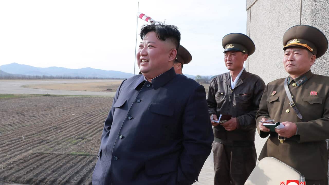 A photo released by the North Korean Central News Agency shows Kim Jong-un and state officials.