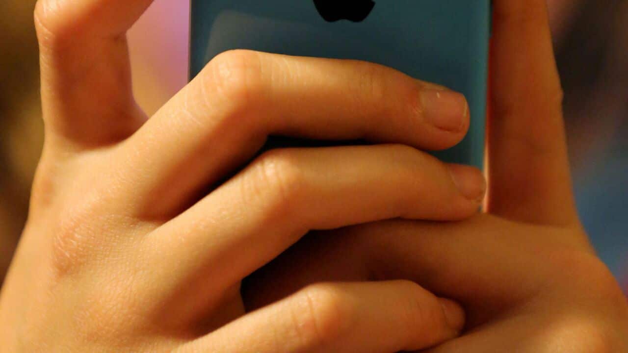 A child using a mobile phone (AAP)