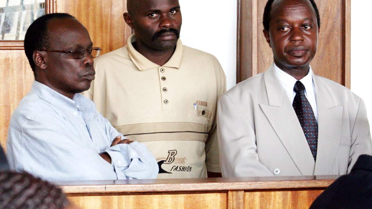 Australian cardiologist, Dr Aggrey Kiyingi (far right) during a court appearance in the Buganda road court, Uganda, Sept. 26, 2005. (AAP)