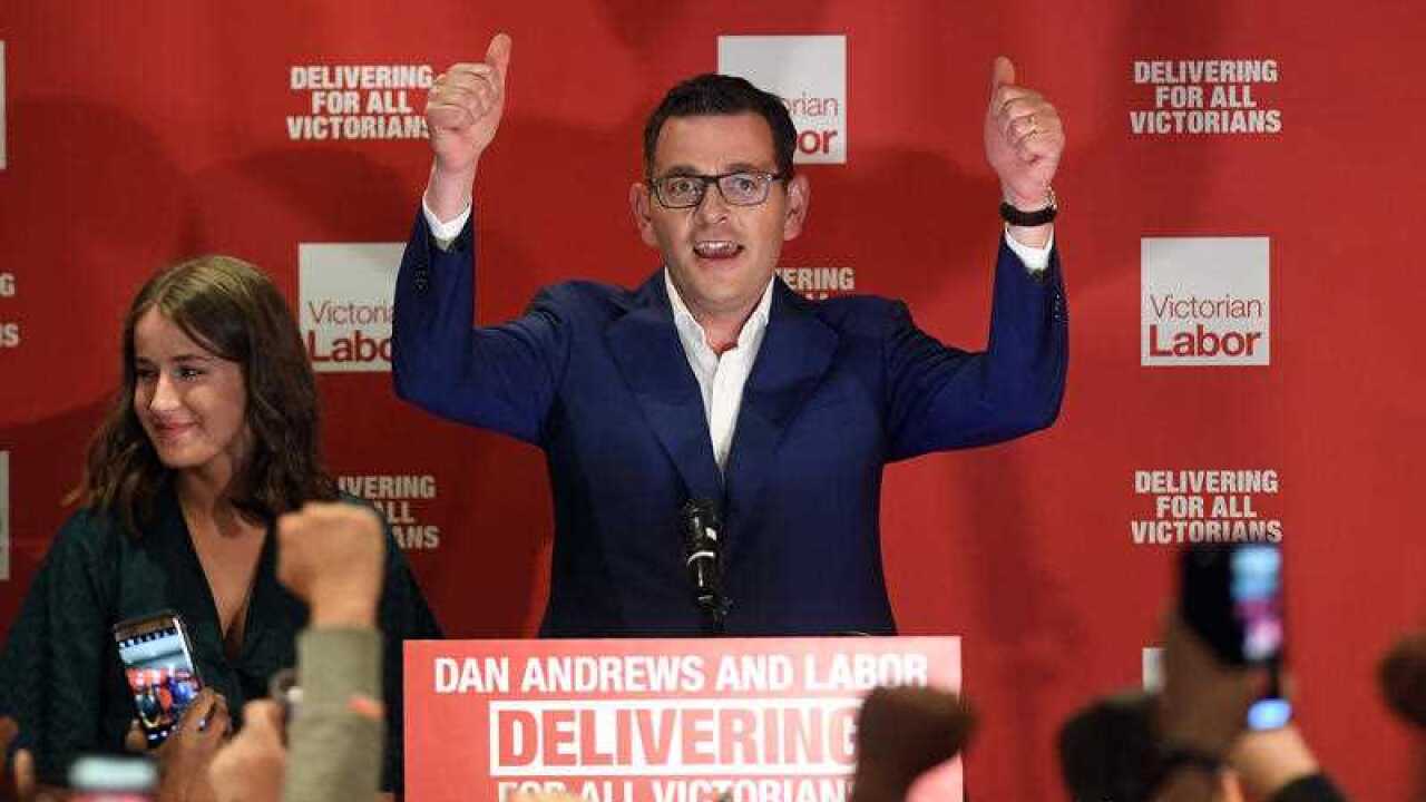 Daniel Andrews reacts as he arrives during the Labor Party reception at the Village Green in Mulgrave on Victorian State election night in Melbourne.