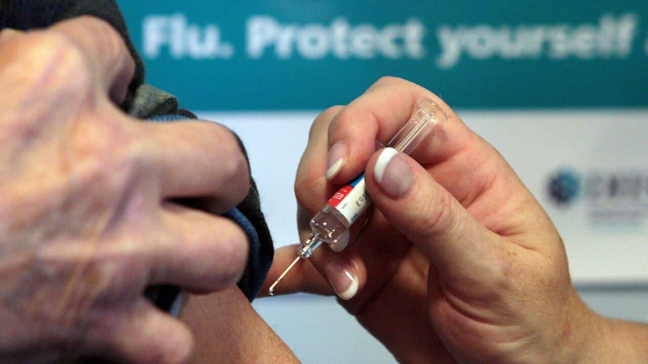 A person getting a flu jab