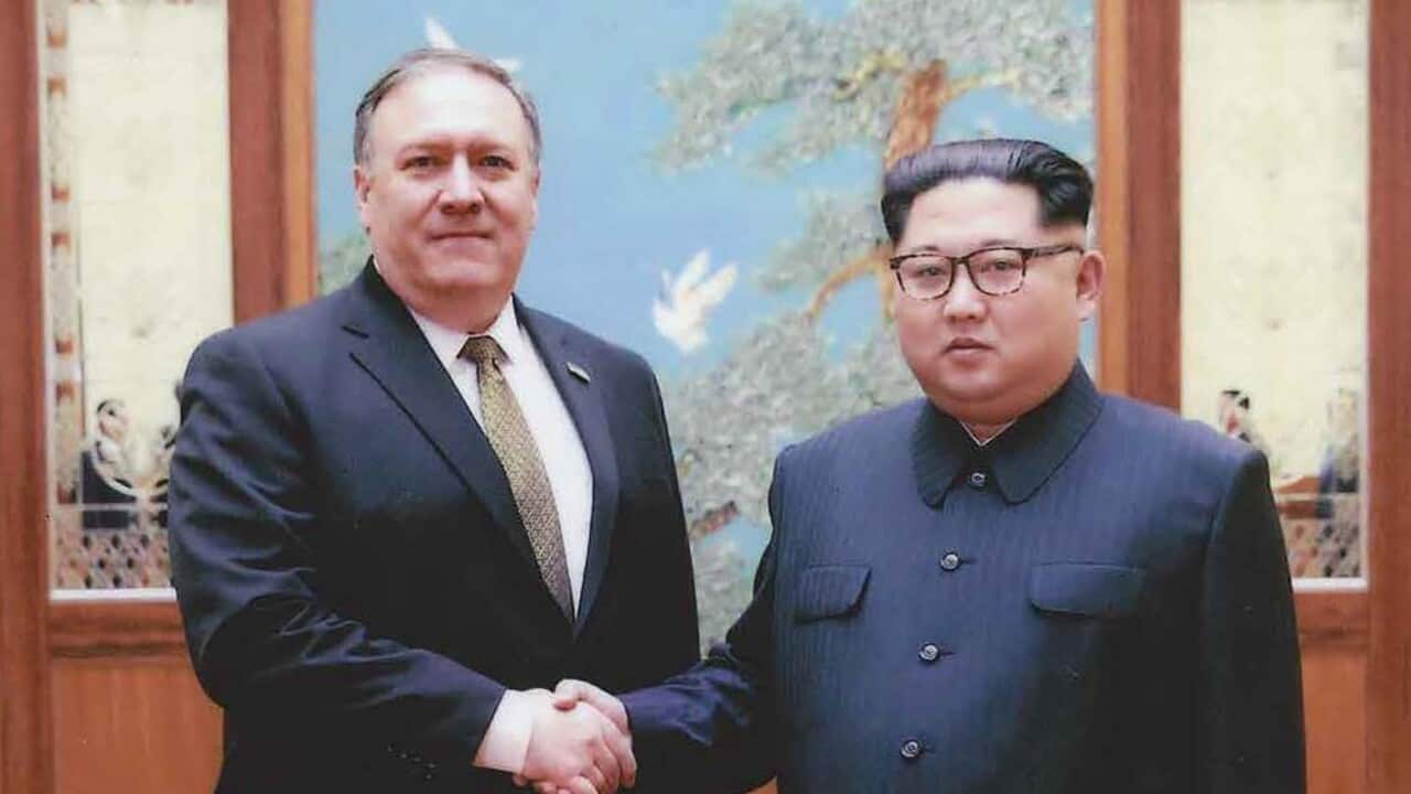 An undated handout photo made available by the US White House on 26 April 2018 shows then-CIA director Mike Pompeo (L) meeting with North Korean leader Kim Jong Un.