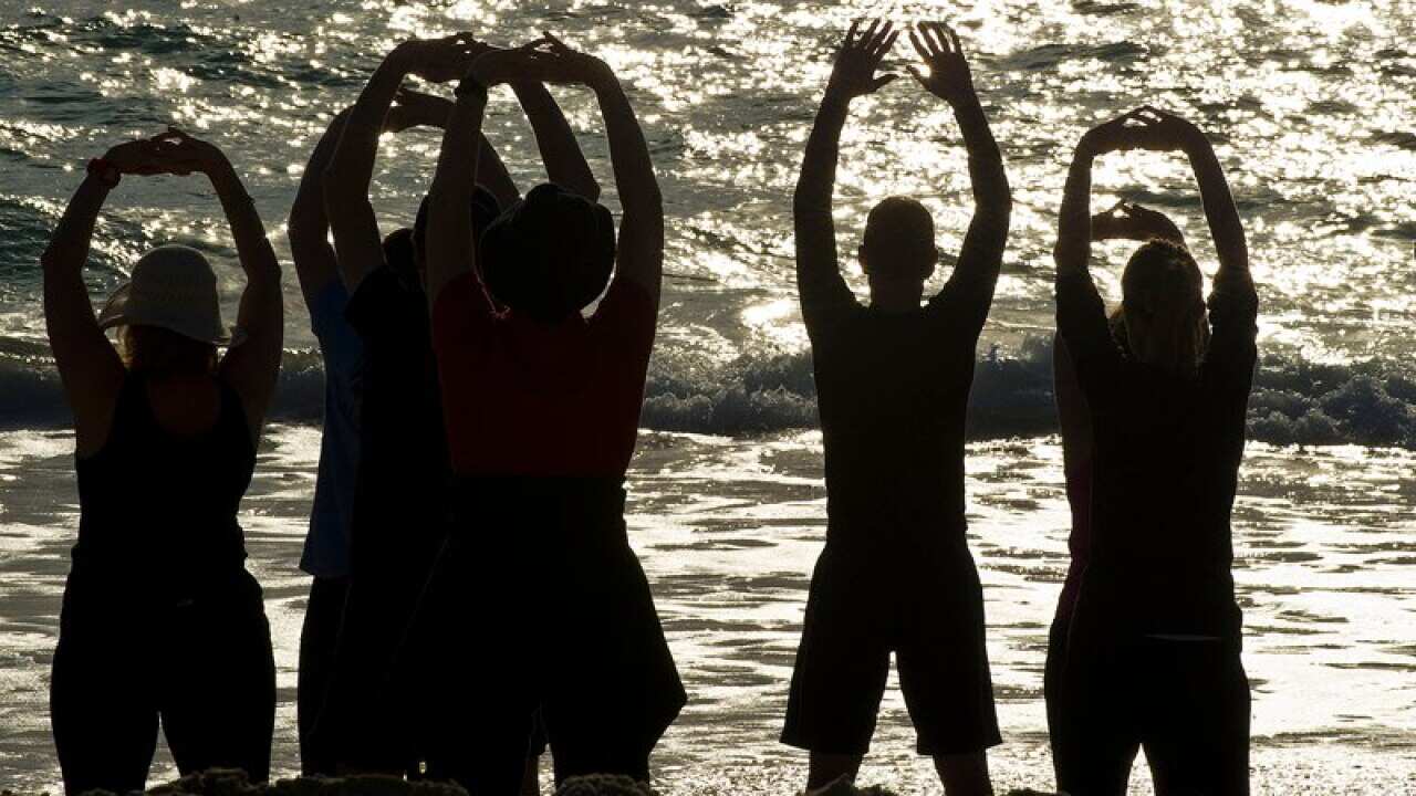 People face the ocean