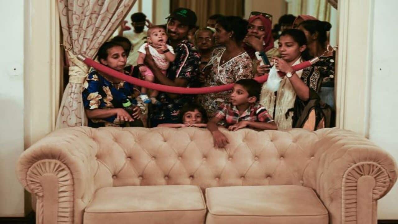 People visit Sri Lankan President Rajapaksa's official residence following his departure