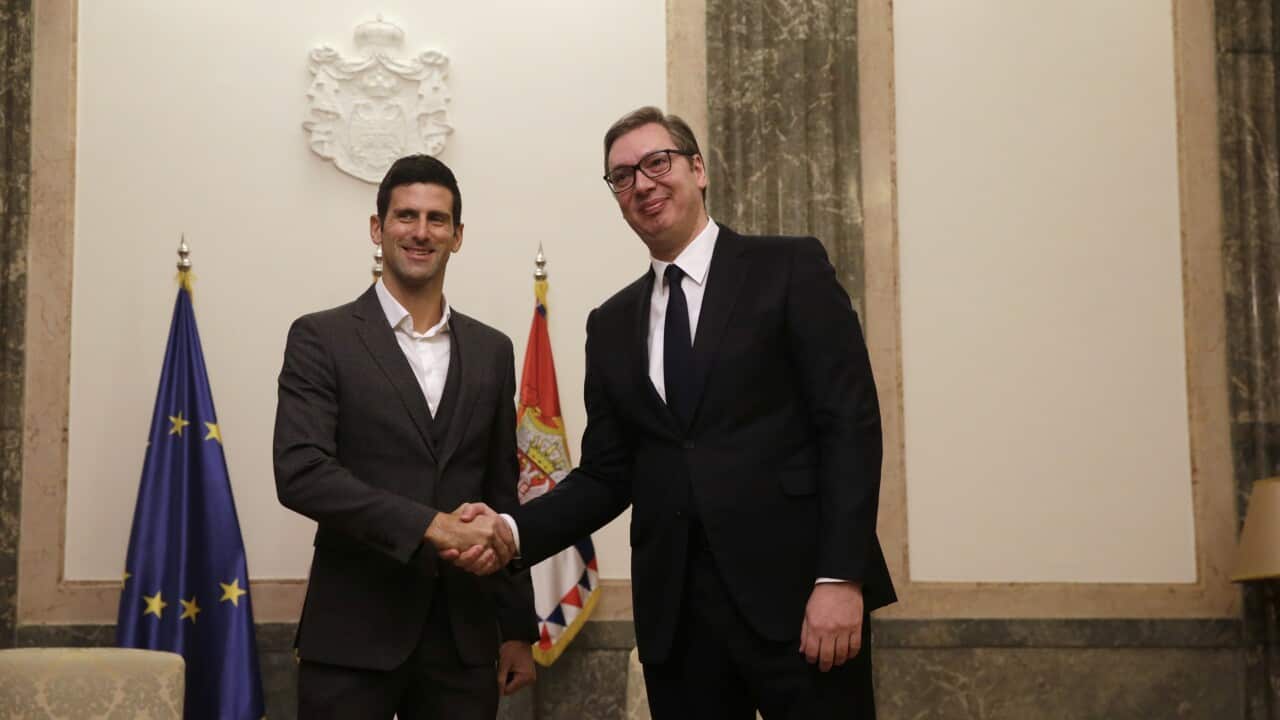 epa09724498 Serbian tennis player Novak Djokovic (L) shakes hands with Serbian President Aleksandar Vucic (R) in Belgrade, Serbia, 03 February 2022. Prosecutors in Serbia have rejected suggestions that Novak Djokovic used a false COVID-19 test to try to e