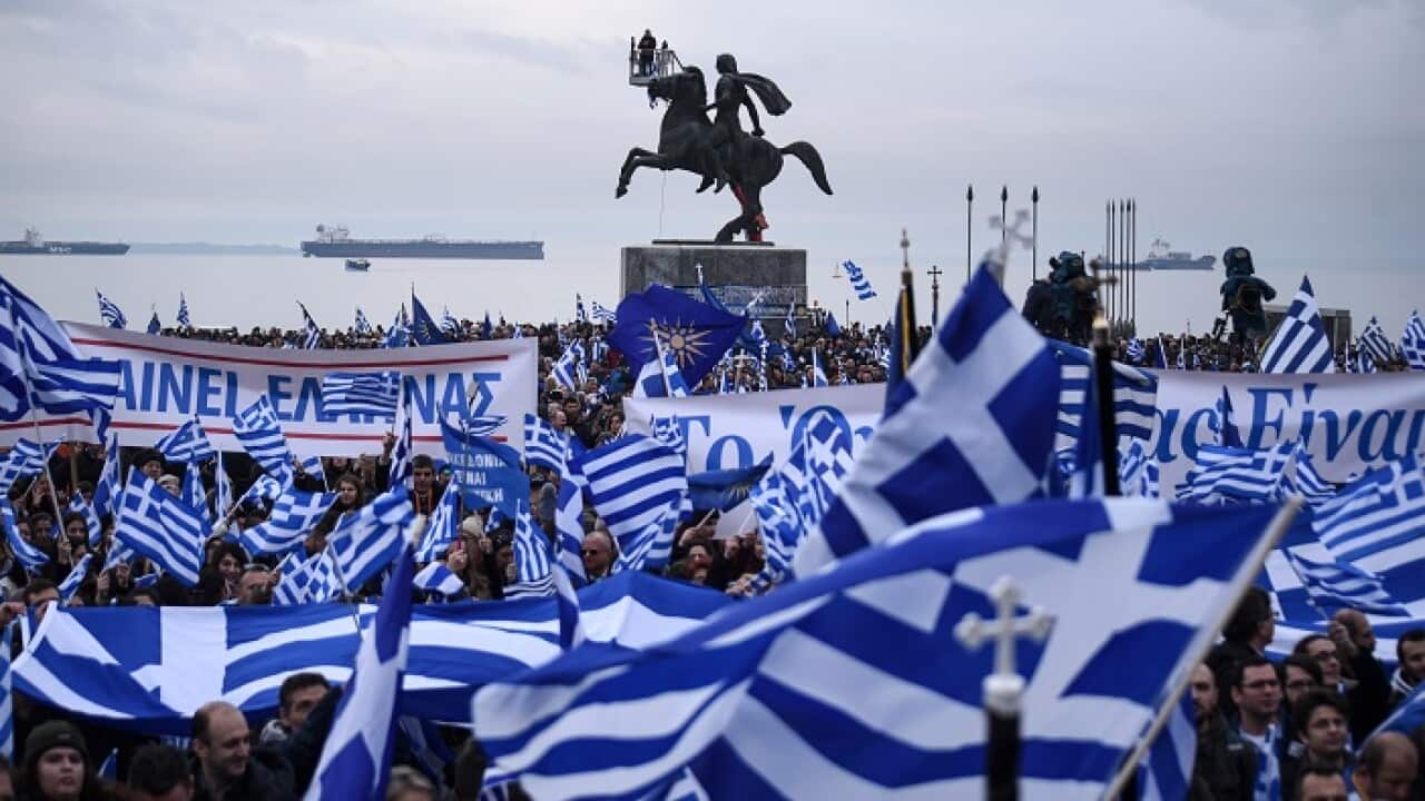 Greek protesters wave flags and banners during a rally against the use of the term "Macedonia" for the northern country's name, at the city of Thessaloniki.