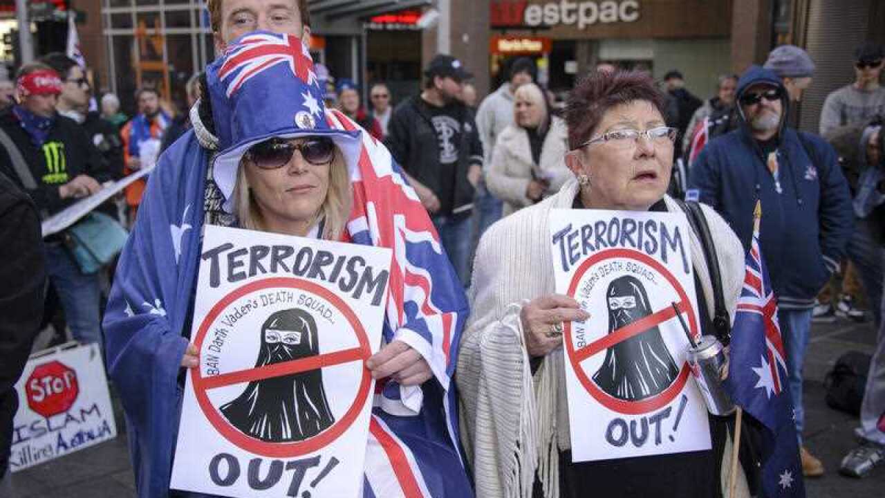 Anti-Islam signs are held as the Reclaim Australia movement held its Sydney rally on July 19, 2015.