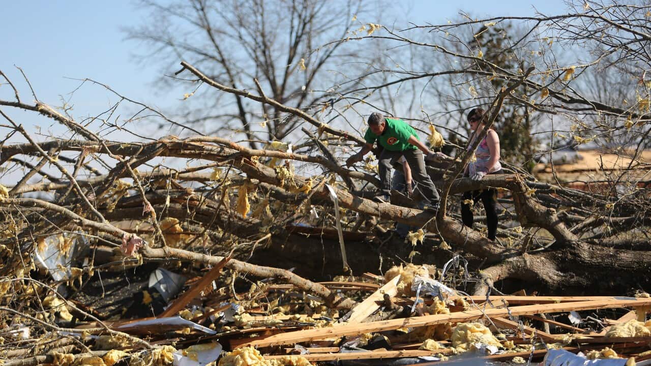 Volunteers help with clean up at Calvary Baptist Church following a tornado.