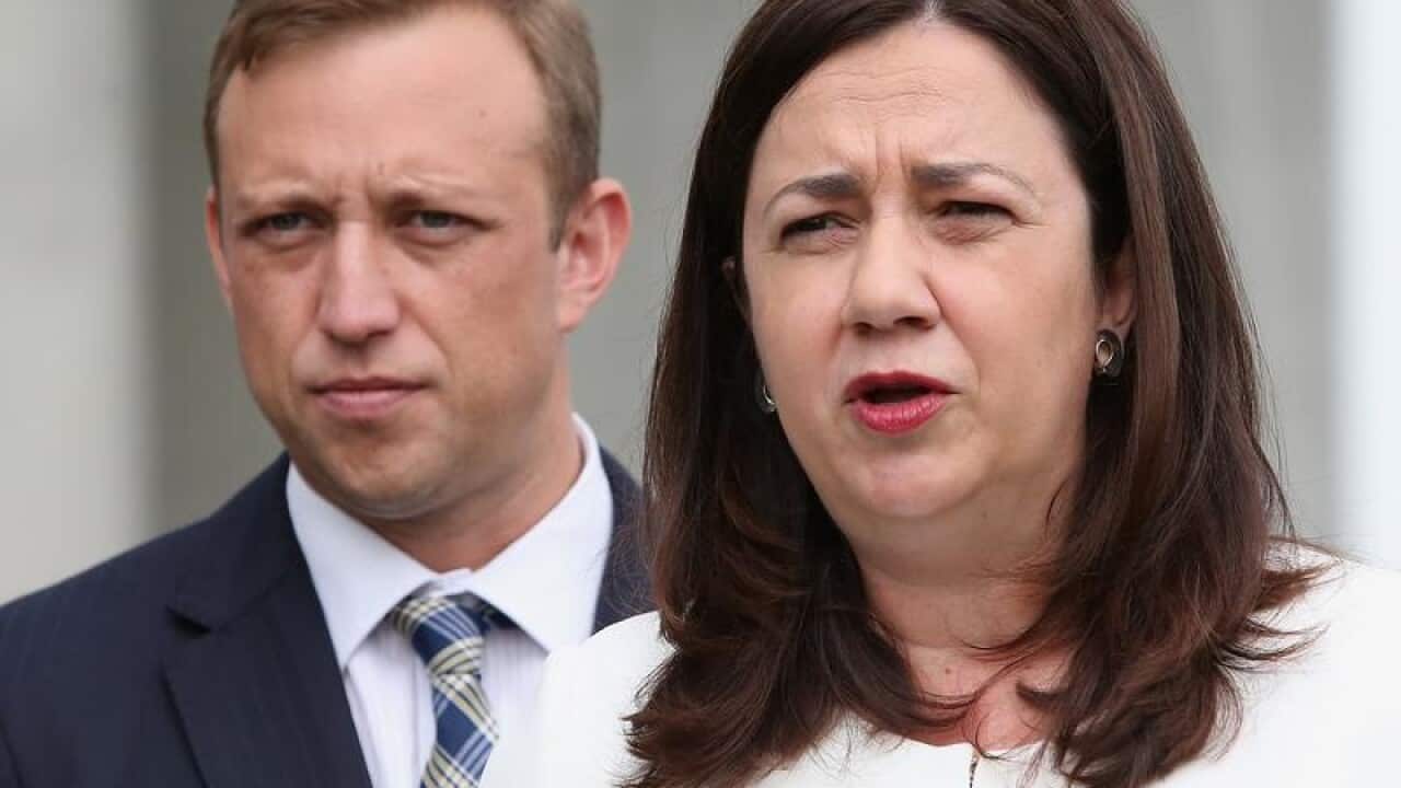 Premier Annastacia Palaszczuk (R) and Health Minister Steven Miles