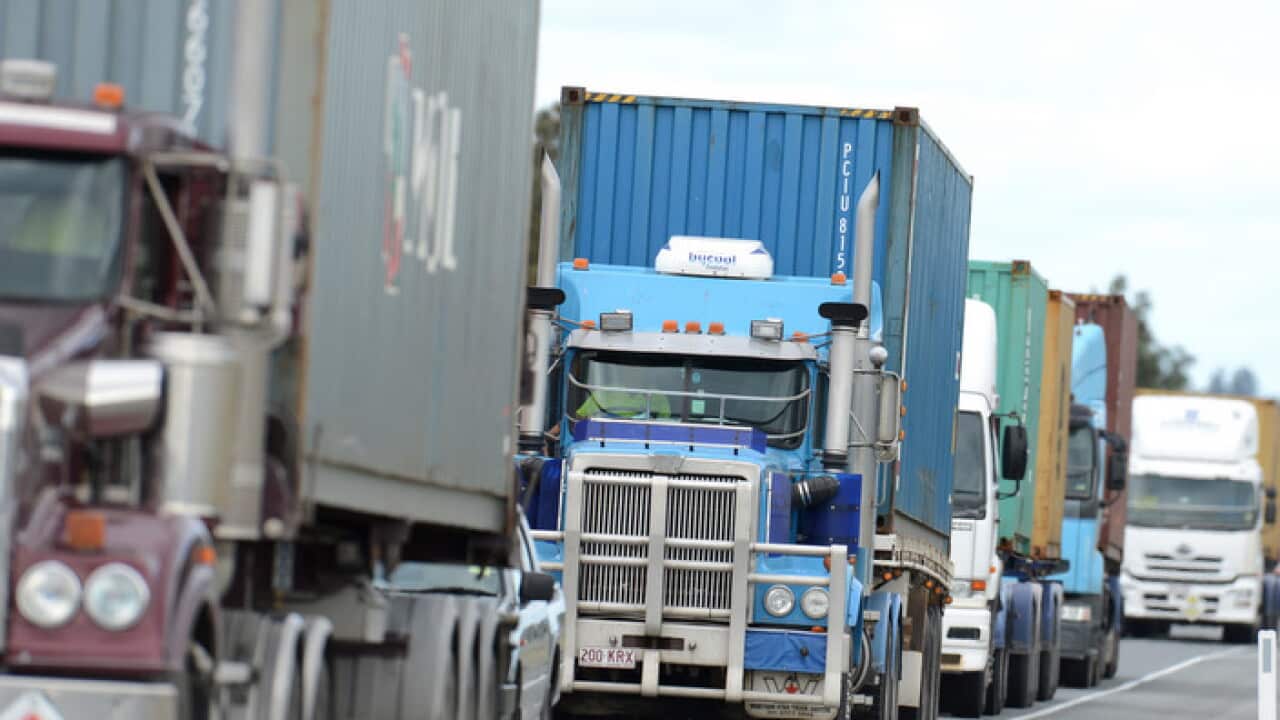 Trucks arrive at the Port of Brisbane, Monday, May 28, 2012. (AAP Image/Dan Peled) NO ARCHIVING