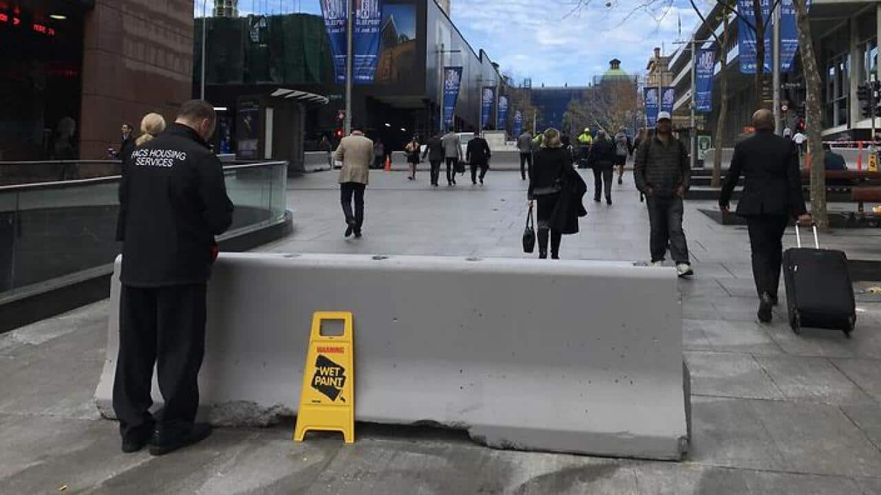 Bollards erected on the sidewalks of Martin Place, Friday, June 23, 2017. (AAP Images/Perry Duffin) NO ARCHIVING