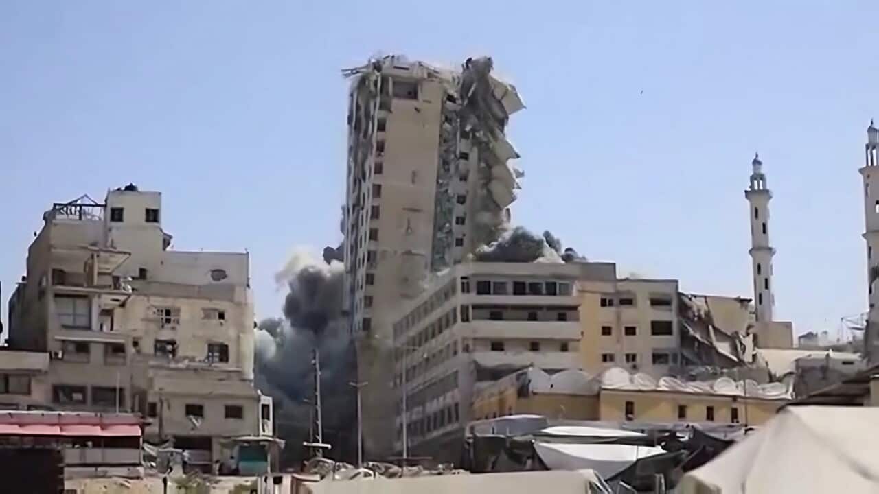 Another building in Gaza is hit by Israeli fire (AP).jpg