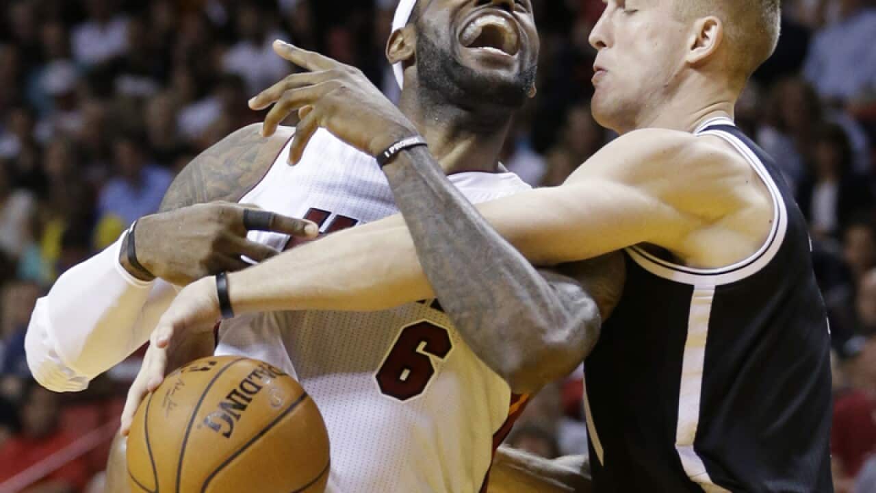 Miami's LeBron James (L) and Brooklyn's Mason Plumlee
