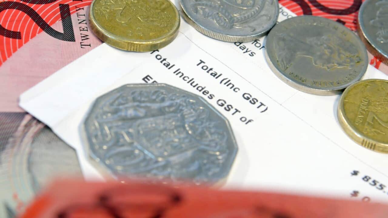 A receipt showing General Sales Tax (GST) is shown alongside Australian notes and coins in Sydney, Wednesday, July 4, 2018. (AAP Image/Sam Mooy) NO ARCHIVING