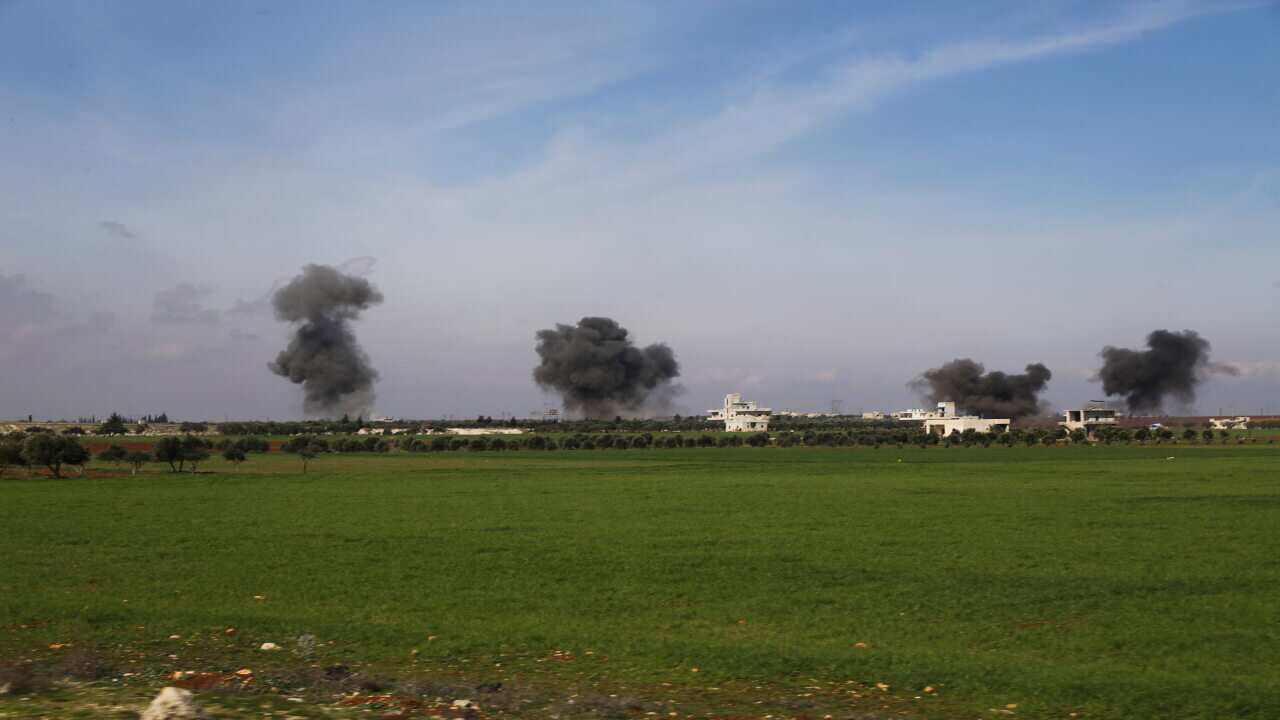 Columns of smoke raise after airstrikes hit town of Saraqeb, in Idlib province, Syria, Thursday, Feb. 27, 2020.