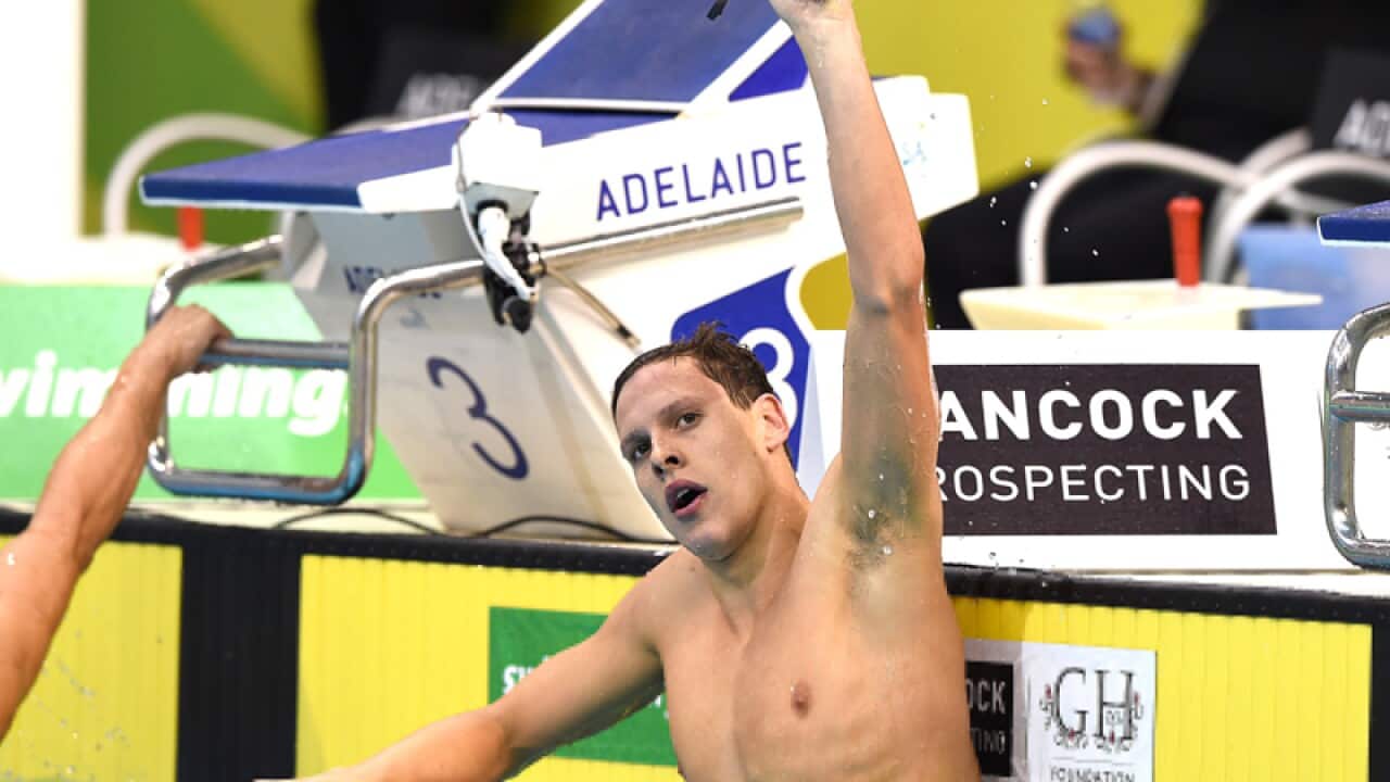 Mitch Larkin reacts after winning the Mens 100m Backstroke
