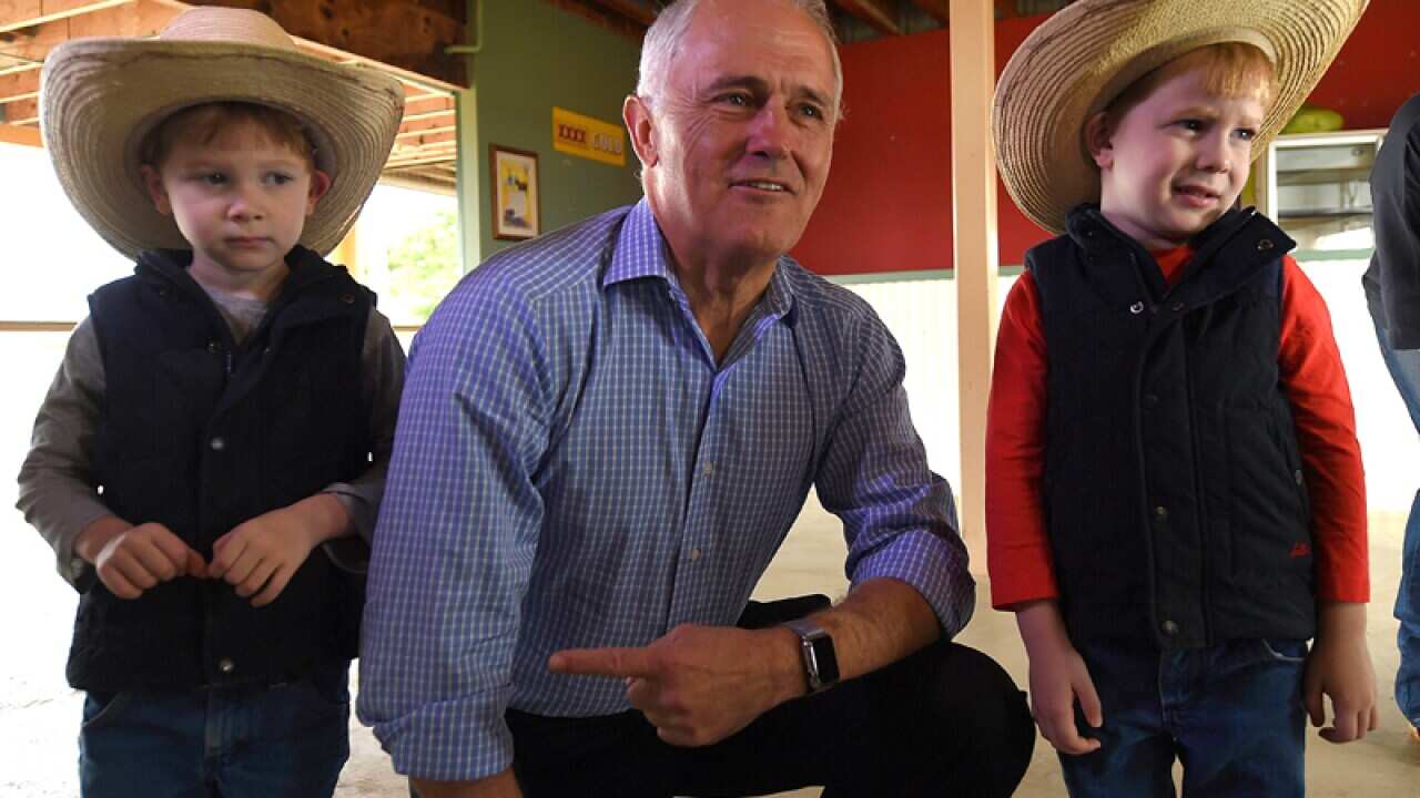 Minister Malcolm Turnbull with Orlando Caton (L) and Presley Caton