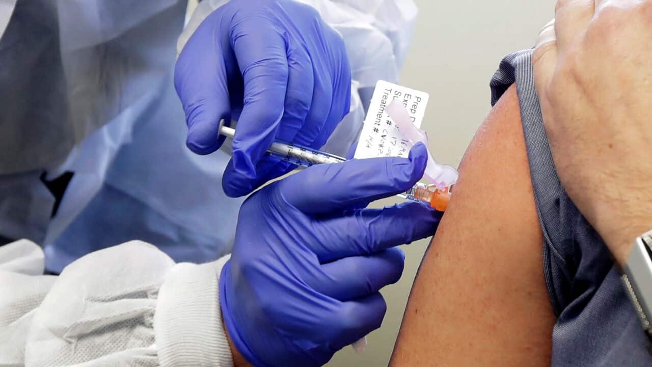 A patient receives a shot in the first-stage safety study of Moderna's potential vaccine