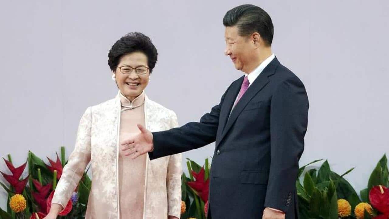 Chinese President Xi Jinping and new Hong Kong Chief Executive Carrie Lam on stage after she is sworn in during her inauguration ceremony. (EPA)