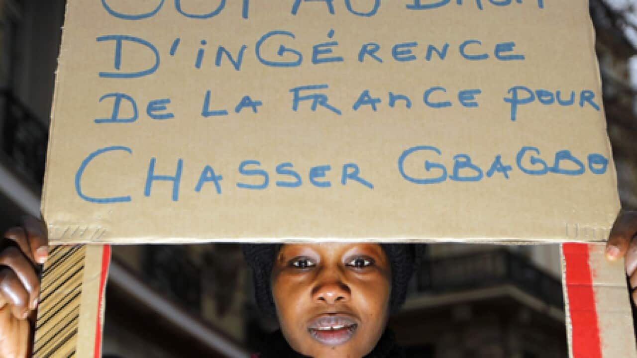 gbagbo_sign_woman_101221_B_getty_821440609