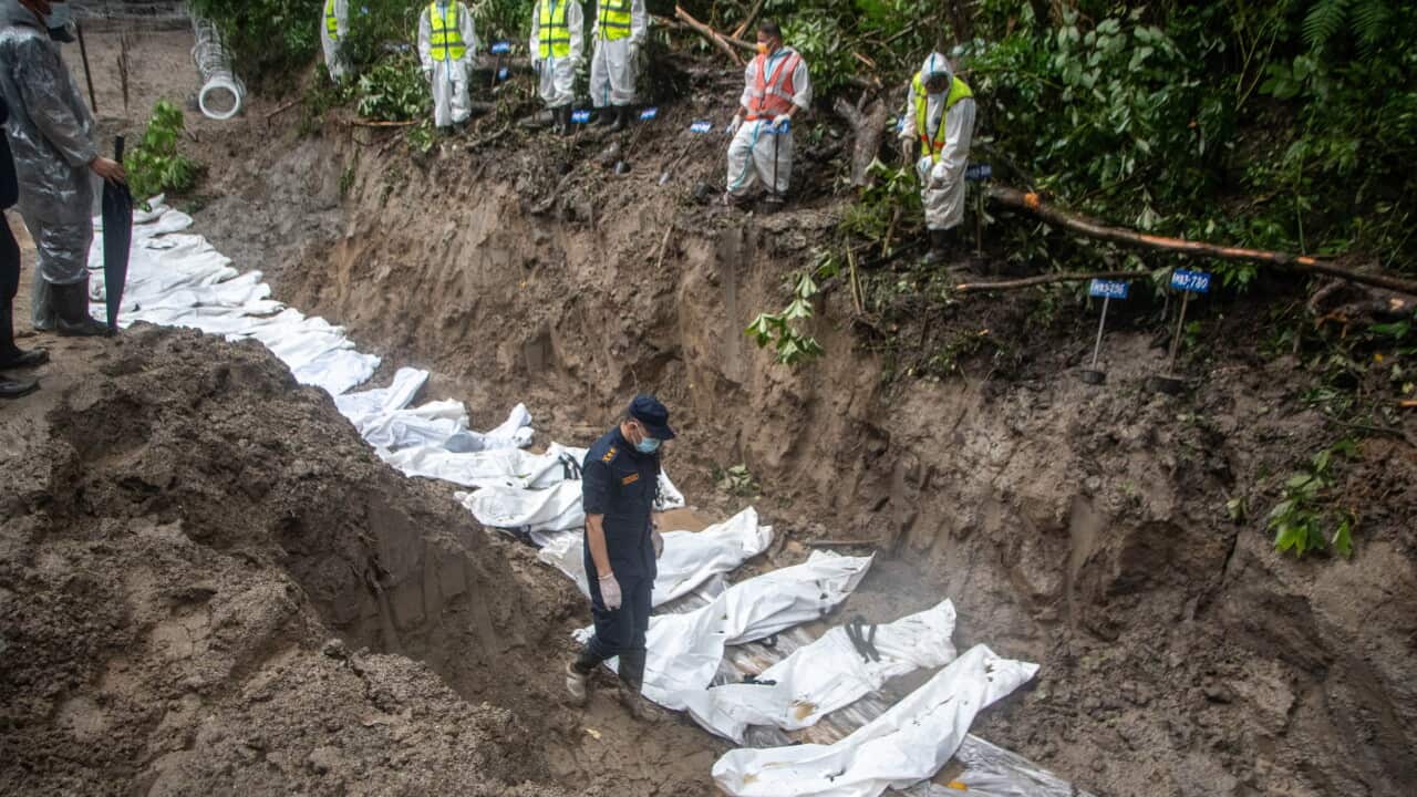 (EDITORS NOTE: Image depicts death) Rescue workers and