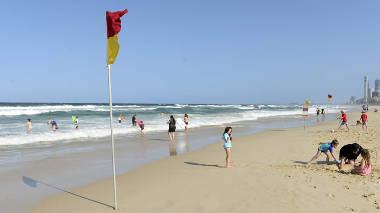 Beachgoers escape the heat at Main Beach on the Gold Coast