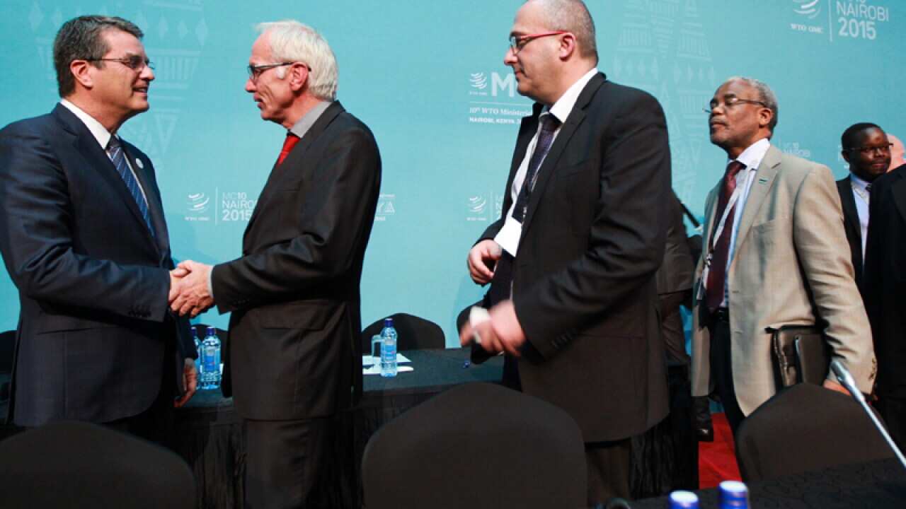 Delegates queue to greet Director-General of the WTO Roberto Azevedo
