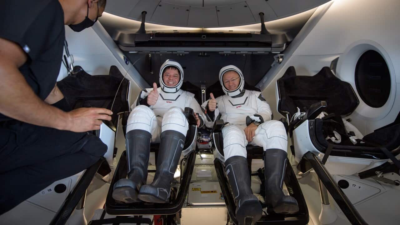 NASA astronauts Robert Behnken (L) and Douglas Hurley after splashdown