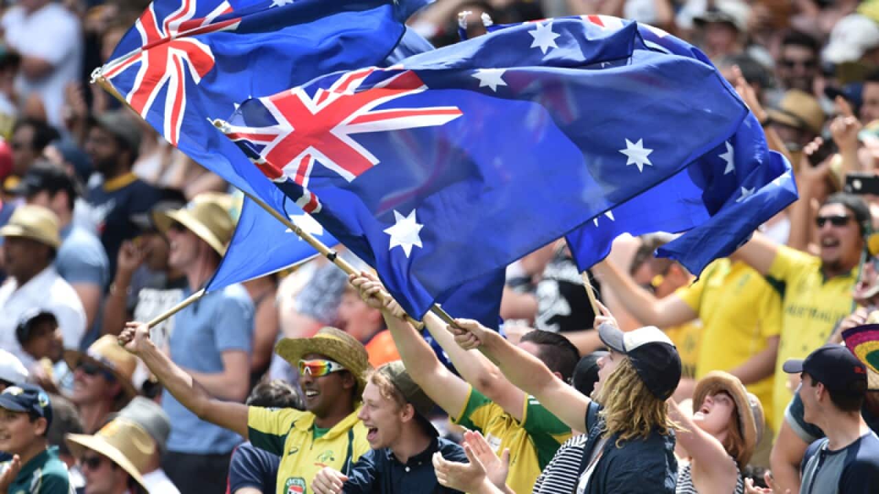 Fans wave Australian flags during the Boxing Day test match