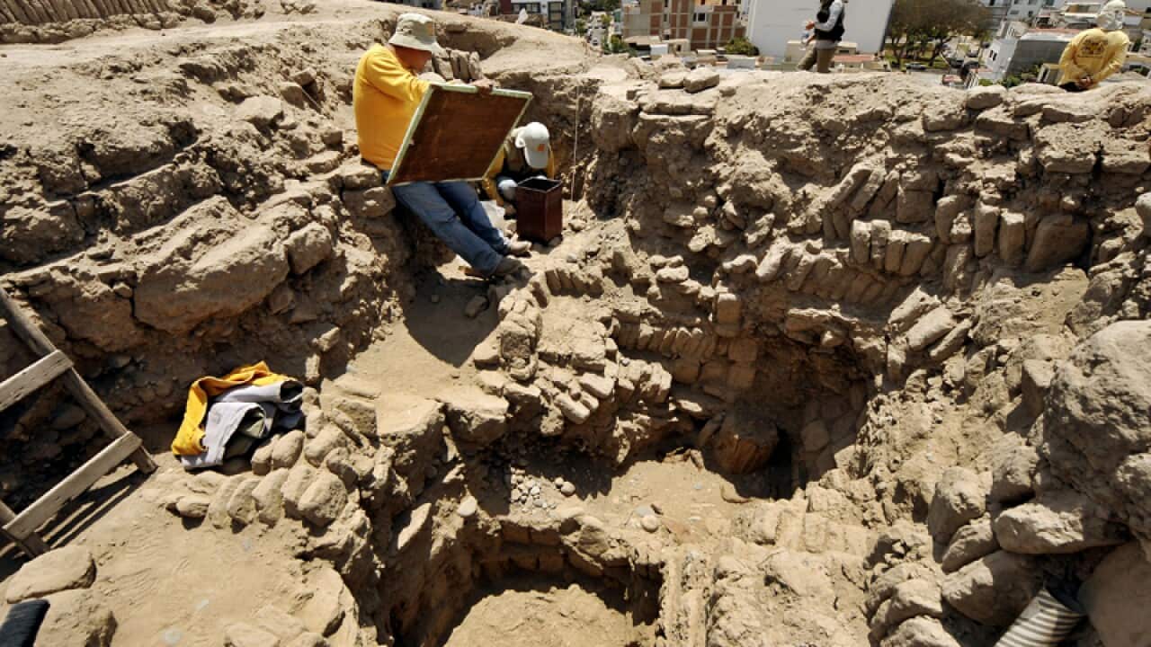 Archaeologists work at the pre-Inca religious complex "Huaca Pucllana"