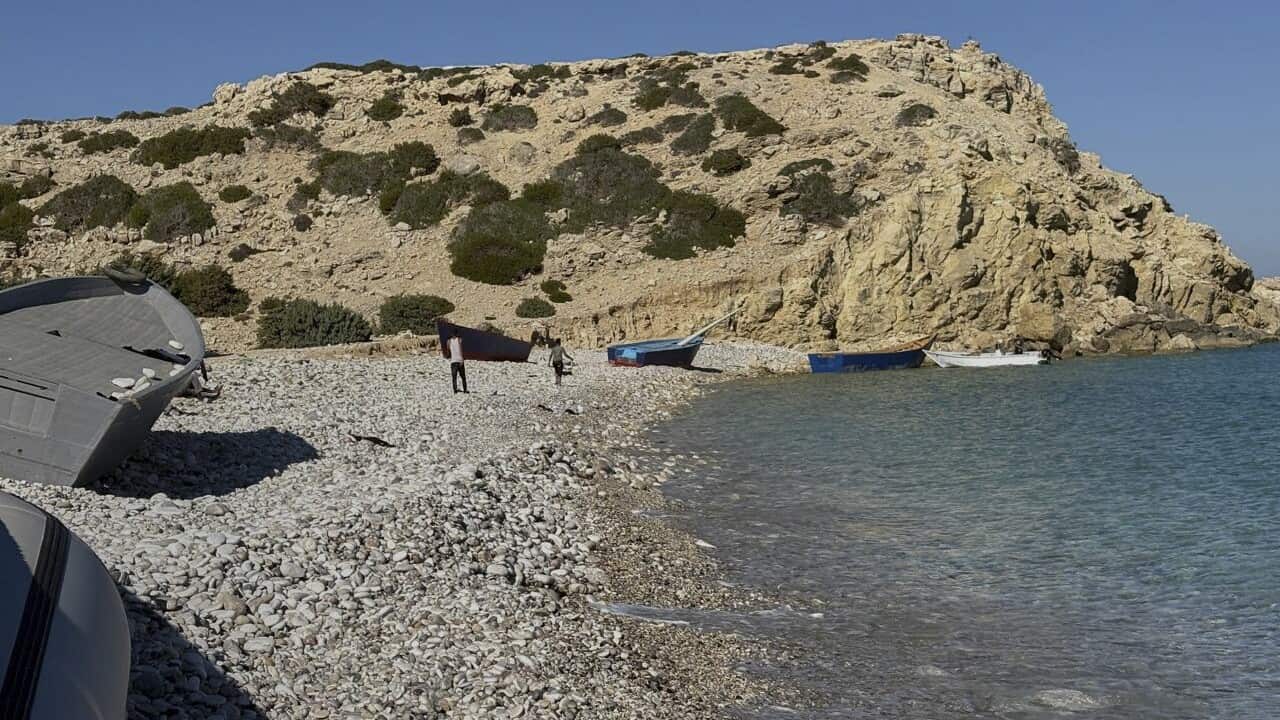 Boats used by migrants at Tripiti beach, Gavdos island , Greece, the southernmost point of Europe,