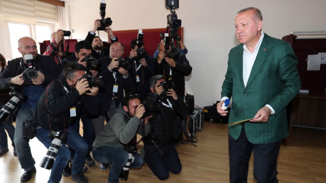 Turkey's President Recep Tayyip Erdogan, walks to cast his ballot during the local elections, in Istanbul, Sunday, March 31, 2019. (Presidential Press Service via AP, Pool)