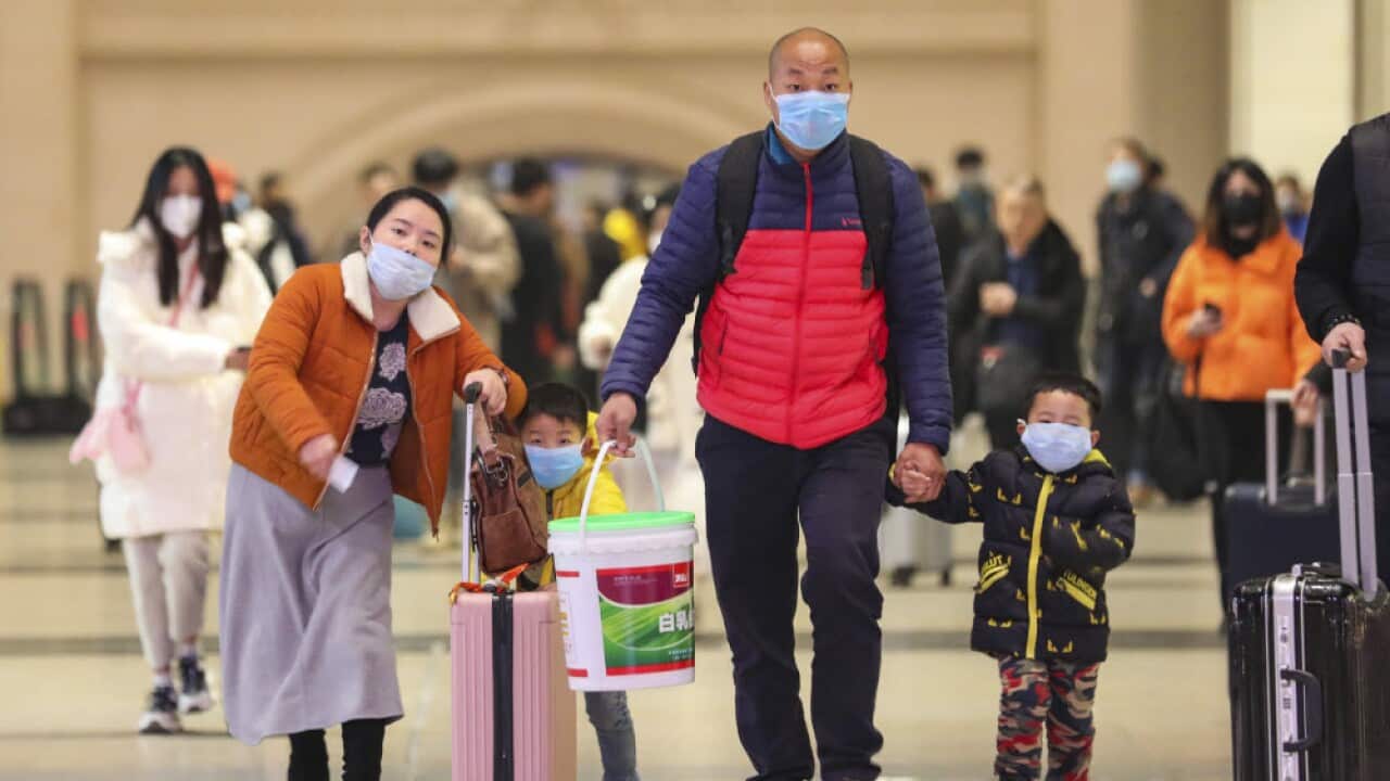 Travelers at Hankou Railway Station in Wuhan in southern China's Hubei province.