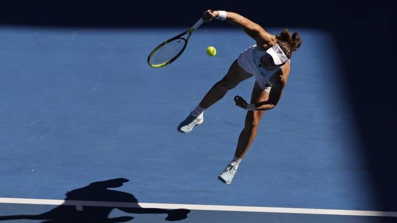 Australia's Samantha Stosur serves to Monica Puig.