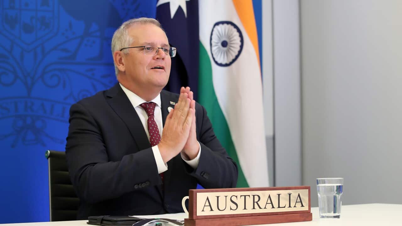 Australian Prime Minister Scott Morrison speaks with Indian Prime Minister Narendra Modi during a virtual leaders' summit in Brisbane, Monday, March 21, 2022. (AAP Image/Jono Searle) NO ARCHIVING