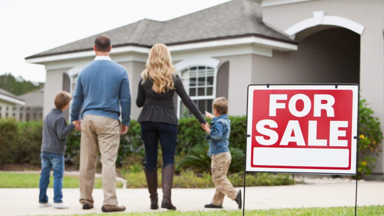 Family looking at house for sale