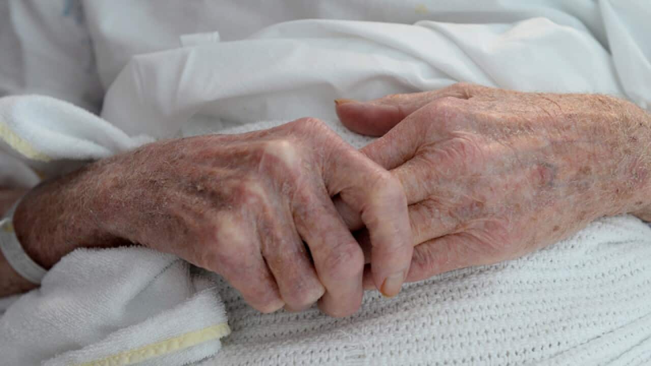 An elderly patient's hands