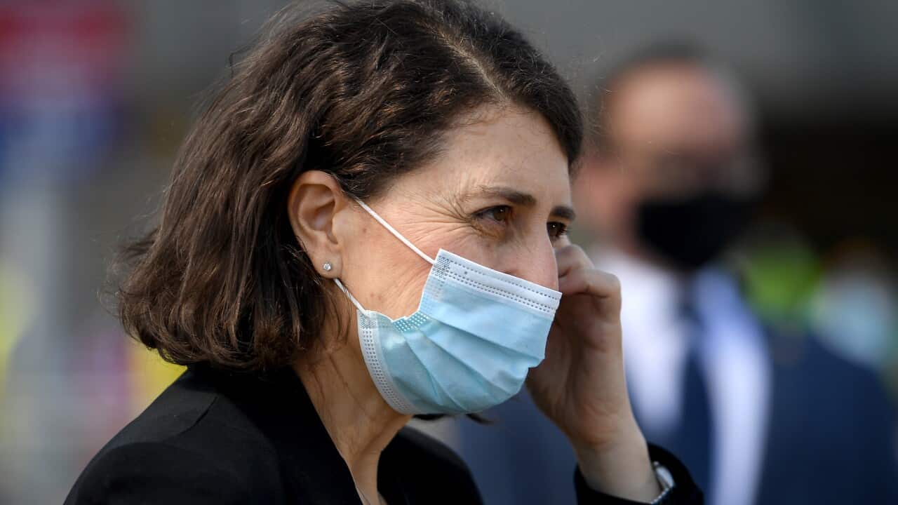 NSW Premier Gladys Berejiklian prepares to address media during a press conference outside the Covid Vaccination hub at Macquarie Fields, south west of Sydney, Friday, September 24, 2021. (AAP Image/Dan Himbrechts) NO ARCHIVING