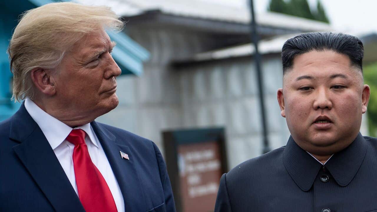 US President Donald Trump and North Korea's leader Kim Jong-un talk before a meeting in the Demilitarized Zone.