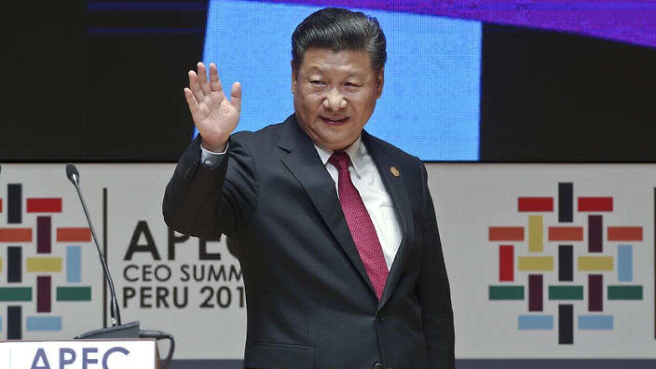 China's President Xi Jinping waves after speaking at the CEO summit during the annual Asia Pacific Economic Cooperation (APEC) forum in Lima, Peru, Saturday, Nov. 19, 2016. (AP Photo/Esteban Felix)