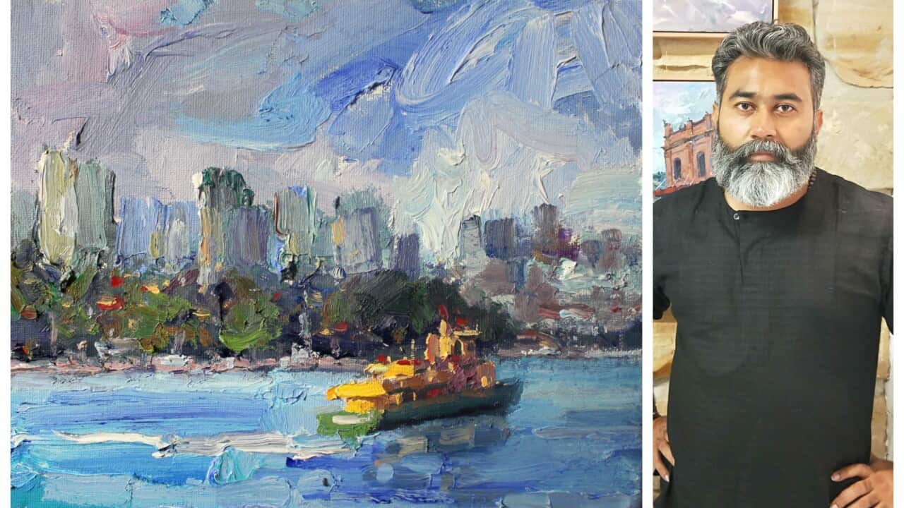 Hiren Patel (R), with his painting.