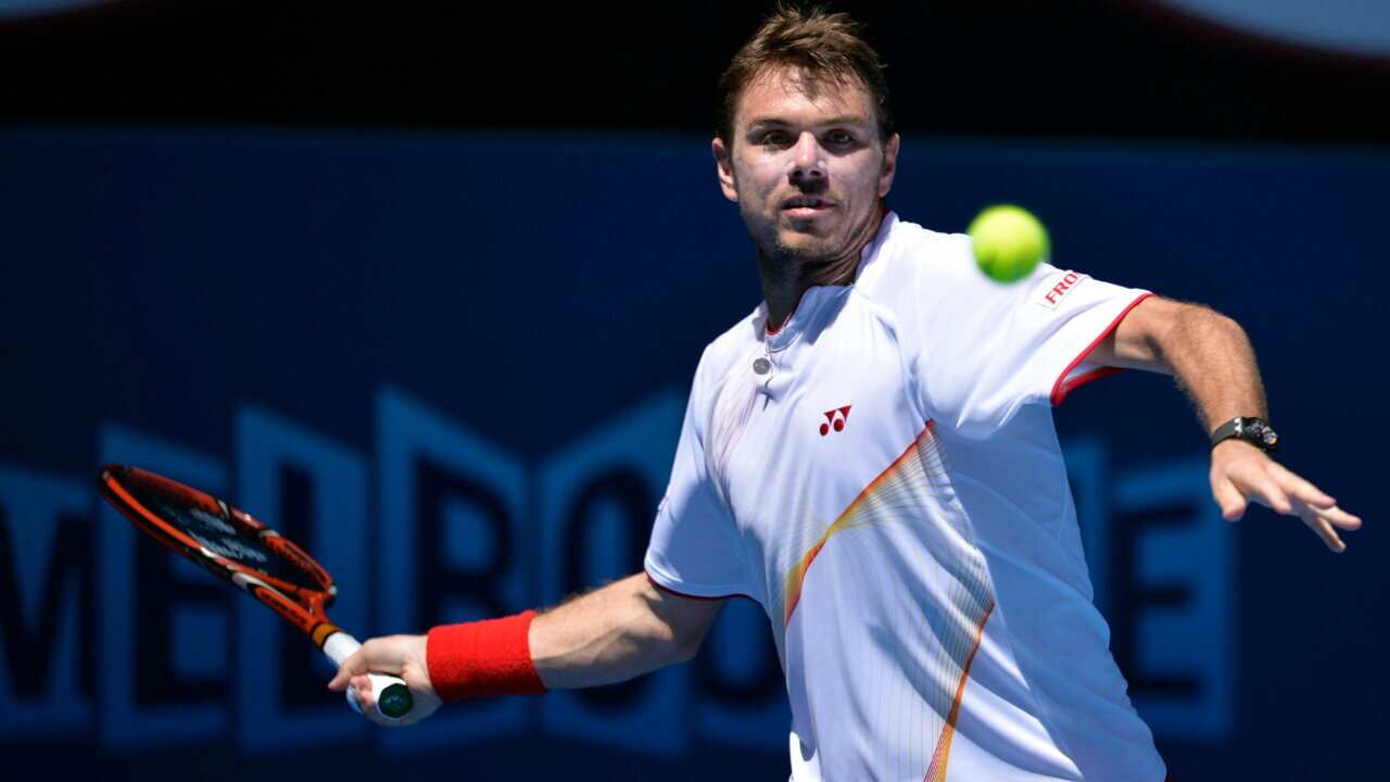 Stanislas Wawrinka of Switzerland returns the ball Andrey Golubev of Kazakhstan - AAP-1.jpg