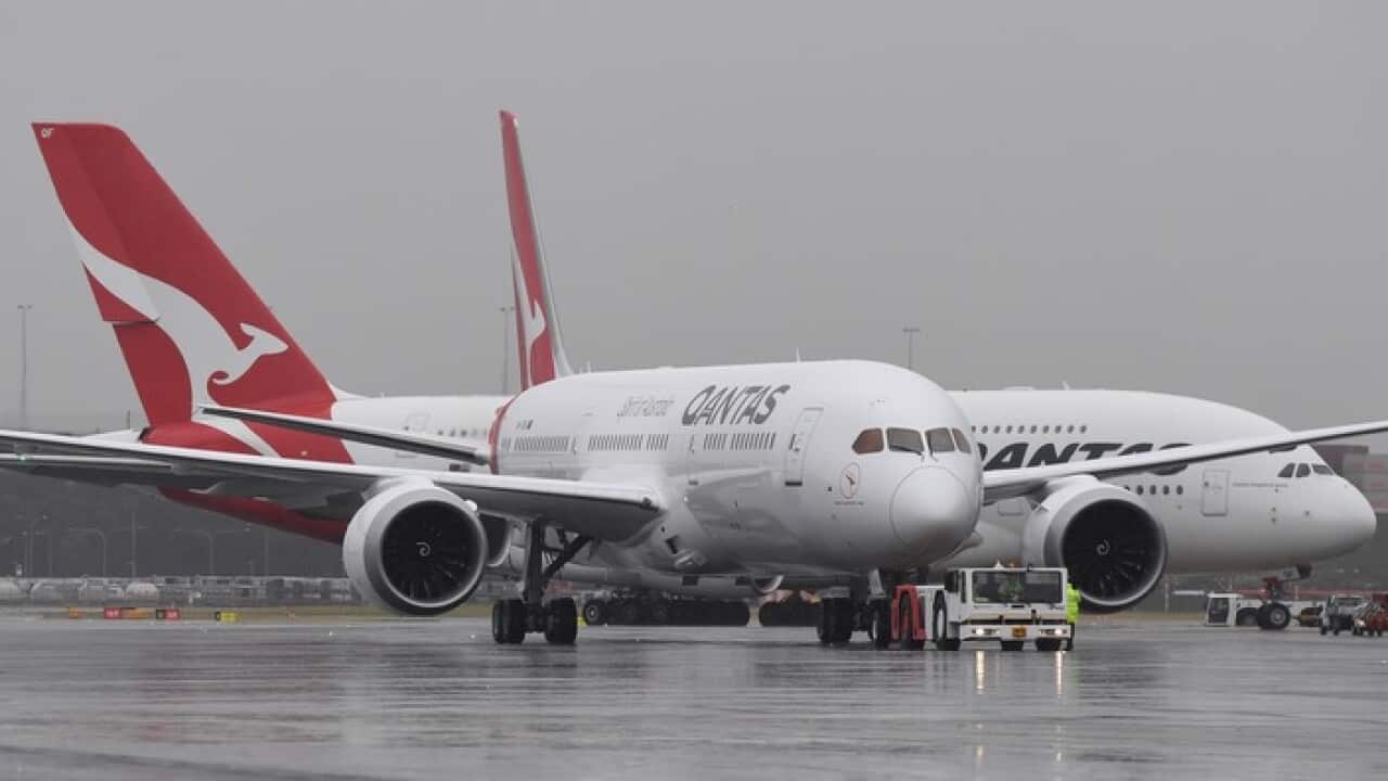 The new QANTAS Boeing 787 Dreamliner aircraft is followed by an A380 Airbus as it arrives on its first flight into Sydney, Friday, October, 20, 2017. (AAP Image/Dean Lewins) NO ARCHIVING