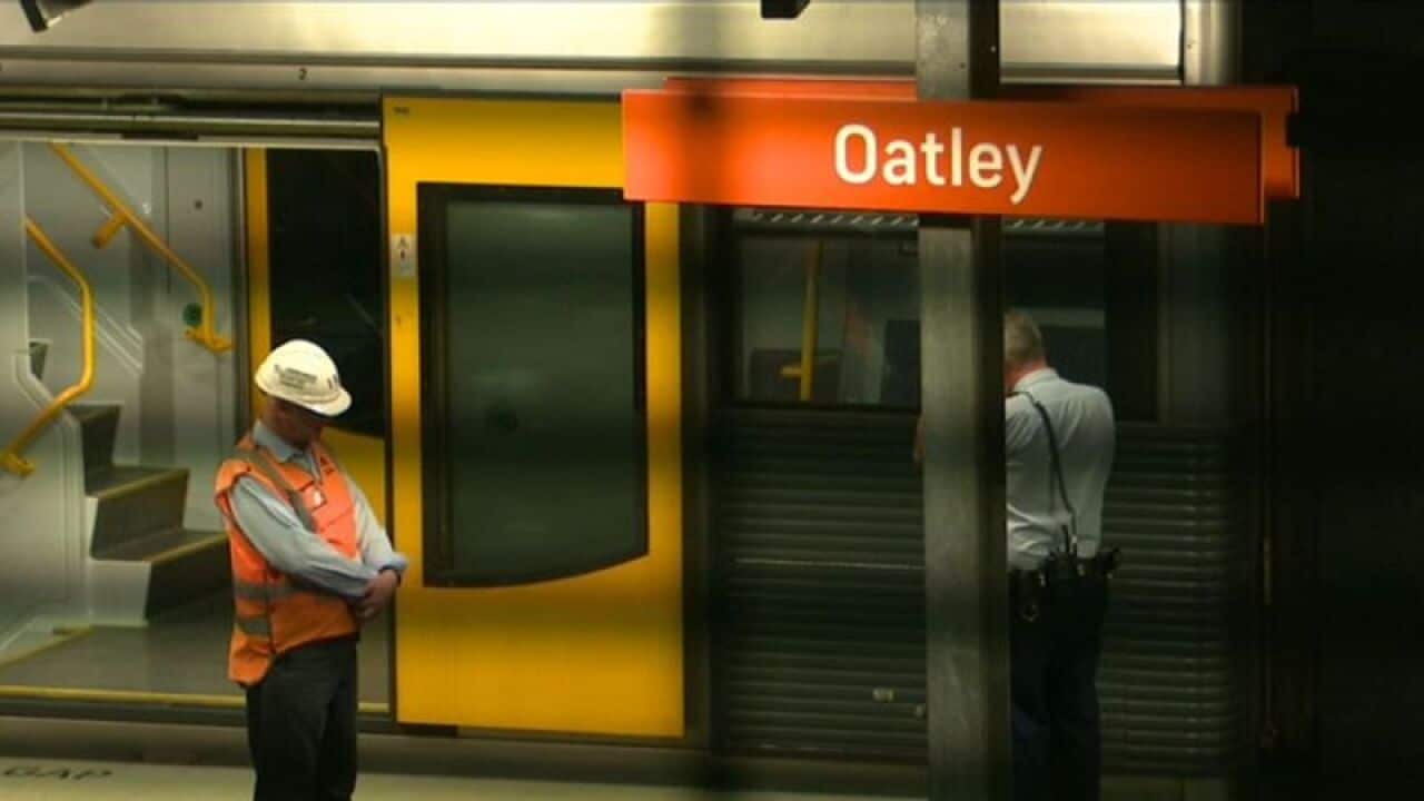Police and rial workers at the train station